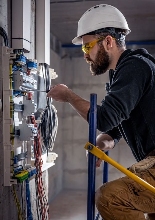 Electrical engineer inspecting a distribution board
