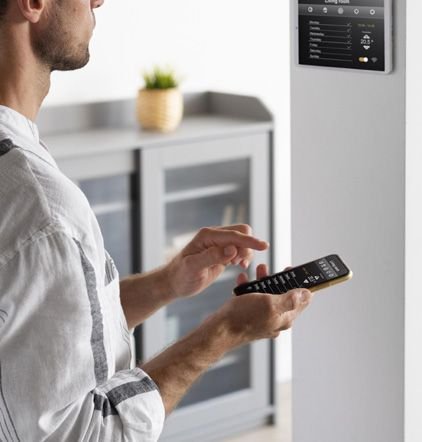 Technician configuring a smart access panel from a phone
